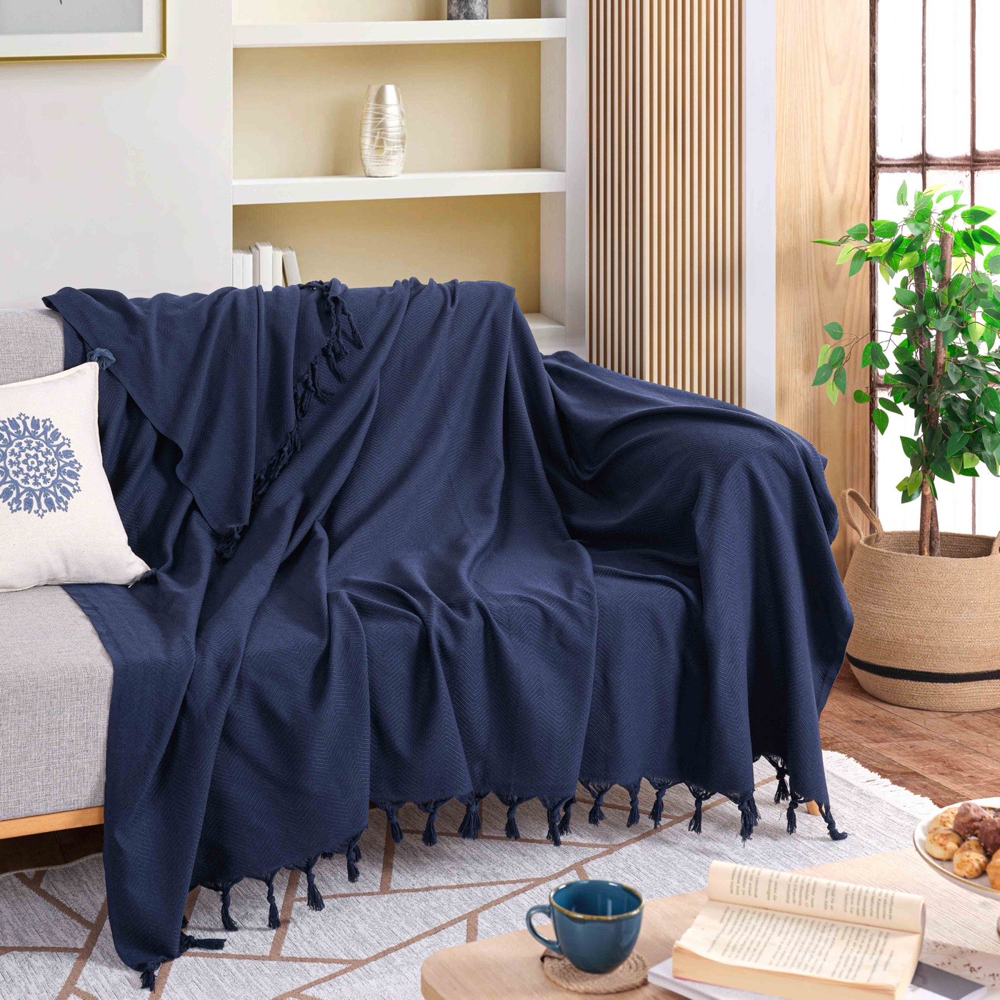 Milam London navy herringbone sofa throw on a sofa